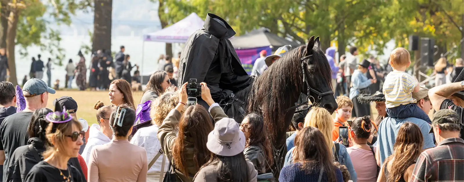Whoa, is that a headless horseman riding atop of a black stallion? Yes it is. Festival goers snap pics of this iconic moment.